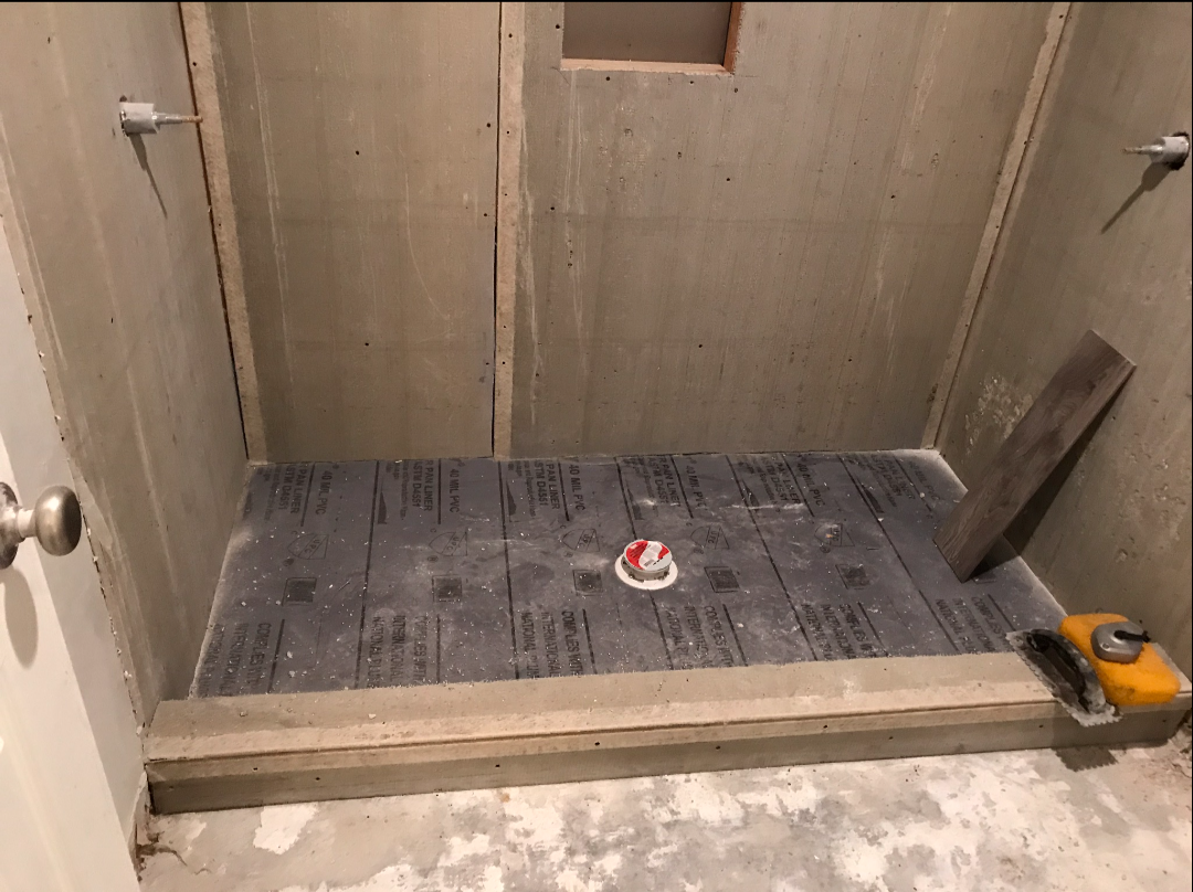 Waterproofed shower pan ready for tile