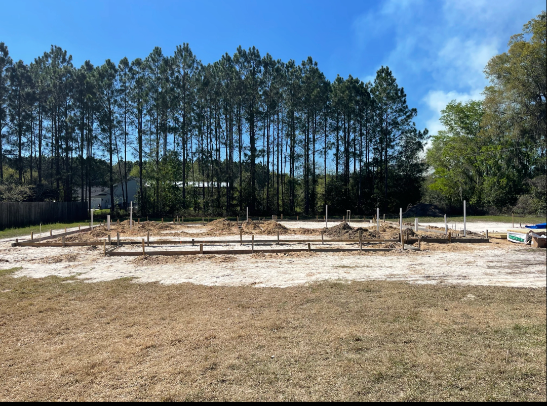 Foundation site layout with plumbing stub-ups ready for build